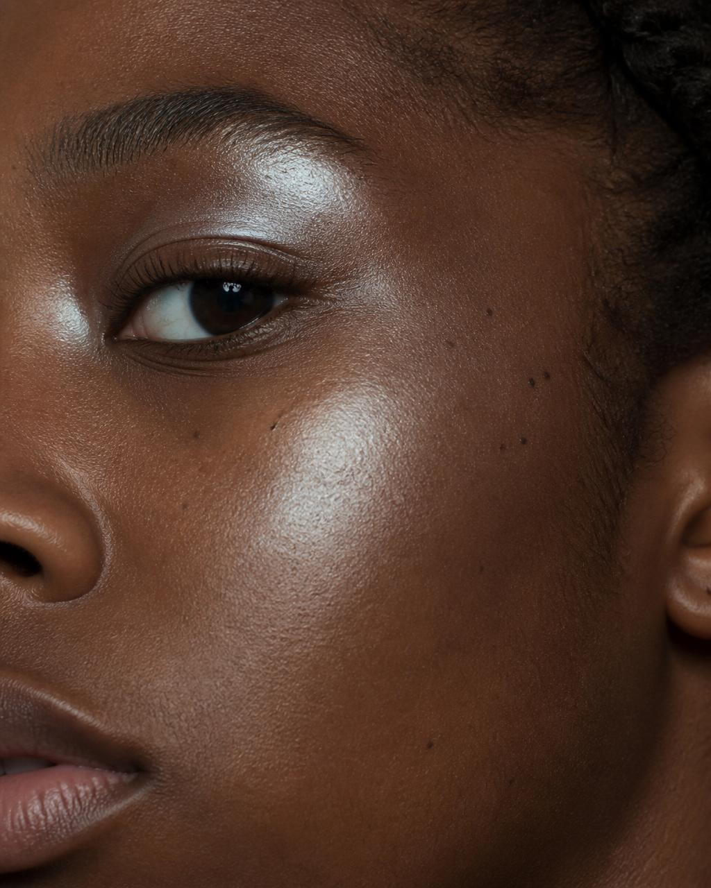 Ultra-fine pearl shimmer catching the light on skin