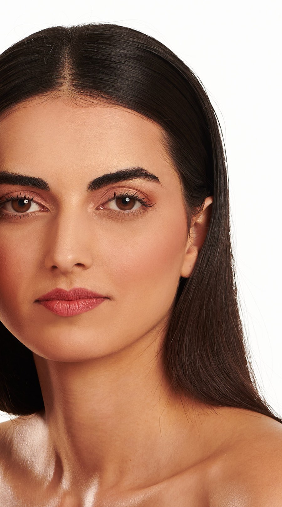 A model photographed in even light, used to show where skin colour changes across the face and neck